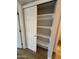 Bright closet includes sliding doors and white shelving for storage space at 170 E Guadalupe Rd # 173, Gilbert, AZ 85234
