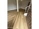Welcoming foyer with wood-look flooring and a staircase, offering a modern aesthetic at 170 E Guadalupe Rd # 173, Gilbert, AZ 85234
