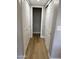 Hallway featuring wood flooring and access to multiple closets at 170 E Guadalupe Rd # 173, Gilbert, AZ 85234