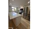 Modern kitchen features stainless steel appliances, island seating with granite countertops, and bright lighting at 170 E Guadalupe Rd # 173, Gilbert, AZ 85234