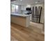 Stylish kitchen with white cabinets, stainless steel appliances, and an island with granite countertop at 170 E Guadalupe Rd # 173, Gilbert, AZ 85234