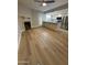 Open-concept kitchen with modern appliances, island seating, and seamless flow to the living area at 170 E Guadalupe Rd # 173, Gilbert, AZ 85234