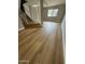 Bright living room showcasing staircase access, large windows, and contemporary flooring at 170 E Guadalupe Rd # 173, Gilbert, AZ 85234