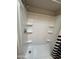 Shower features multiple shelves for toiletries and a shower curtain at 170 E Guadalupe Rd # 173, Gilbert, AZ 85234