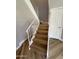 Staircase featuring wood steps and white railings at 170 E Guadalupe Rd # 173, Gilbert, AZ 85234