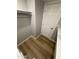 Bright walk-in closet features built-in shelving and a wooden floor offering organized storage at 170 E Guadalupe Rd # 173, Gilbert, AZ 85234