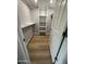 A walk-in closet with wood floor, shelving, and plenty of storage space, perfect for organizing any wardrobe at 170 E Guadalupe Rd # 173, Gilbert, AZ 85234