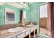 Bathroom featuring double sinks, large mirror, natural light, and ample counter space at 1715 S Cholla St, Mesa, AZ 85202