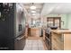 Kitchen with tile floors, stainless steel appliances, and an eat in counter area at 1715 S Cholla St, Mesa, AZ 85202