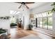 Airy living room with hardwood flooring, built-in shelves, and bright natural light at 1715 S Cholla St, Mesa, AZ 85202