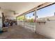 Spacious covered patio with an exposed aggregate surface leading to a fenced-in backyard at 1715 S Cholla St, Mesa, AZ 85202