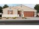 Charming single-story home with a well-maintained front yard and attached two-car garage at 17643 W Mariposa Dr, Goodyear, AZ 85395