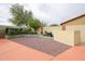 Landscaped backyard with gravel groundcover, string lights, and concrete patio area at 18550 W Mcneil St, Goodyear, AZ 85338