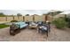Inviting backyard with brick pavers, cozy seating area, and vibrant landscaping for outdoor relaxation at 18550 W Mcneil St, Goodyear, AZ 85338