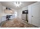 Bright bedroom with built in desk, ceiling fan, and large area rug, offering comfort and functionality at 18550 W Mcneil St, Goodyear, AZ 85338