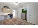 Comfortable bedroom with desk, dresser and ceiling fan at 18550 W Mcneil St, Goodyear, AZ 85338