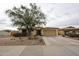 Attractive single-story home with desert landscaping and an attached two-car garage at 18550 W Mcneil St, Goodyear, AZ 85338