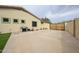 Spacious side yard features a concrete area and secure gate access at 18550 W Mcneil St, Goodyear, AZ 85338