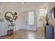 Bright and airy foyer with tile flooring and decorative accents at 18550 W Mcneil St, Goodyear, AZ 85338
