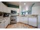 Well-equipped kitchen with stainless steel appliances, granite countertops, and ample cabinet space at 18550 W Mcneil St, Goodyear, AZ 85338