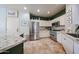 Modern kitchen with stainless steel appliances, granite countertops, and custom cabinetry, perfect for culinary enthusiasts at 18550 W Mcneil St, Goodyear, AZ 85338