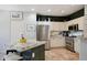 Modern kitchen with stainless steel appliances, granite countertops, and ample cabinet space at 18550 W Mcneil St, Goodyear, AZ 85338
