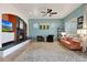 Inviting living room with a cozy fireplace and comfortable seating arrangement at 18550 W Mcneil St, Goodyear, AZ 85338