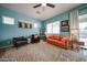 Comfortable living room featuring a cozy seating arrangement, neutral tones, and large windows at 18550 W Mcneil St, Goodyear, AZ 85338
