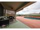 Inviting covered patio with comfortable seating and a refreshing pool for outdoor relaxation and enjoyment at 18550 W Mcneil St, Goodyear, AZ 85338