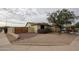 The side yard features privacy wall and low-maintenance desert landscaping at 18550 W Mcneil St, Goodyear, AZ 85338