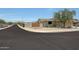 Street view of a well-maintained home with desert landscaping and privacy wall at 18550 W Mcneil St, Goodyear, AZ 85338