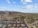 An aerial view of a housing community surrounded by desert landscape at 21132 W Windsor Ave, Buckeye, AZ 85396