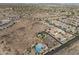 An aerial view of the community pool surrounded by desert homes at 21132 W Windsor Ave, Buckeye, AZ 85396