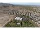 Aerial view features expansive green space, community park, and nearby residential neighborhood in a scenic setting at 21132 W Windsor Ave, Buckeye, AZ 85396