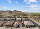 An aerial view of a desert community surrounded by mountains and blue sky at 21132 W Windsor Ave, Buckeye, AZ 85396