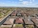 An aerial view of a desert community showing a small lawn in each backyard at 21132 W Windsor Ave, Buckeye, AZ 85396