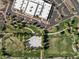Aerial view showcasing a community park with basketball court, playground, and green space surrounded by walking paths at 21132 W Windsor Ave, Buckeye, AZ 85396