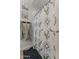 Bathroom shower featuring custom shower curtain, and wood-look flooring at 21132 W Windsor Ave, Buckeye, AZ 85396