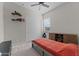 Bedroom with carpeted floors, ceiling fan, window, and wooden dresser at 21132 W Windsor Ave, Buckeye, AZ 85396