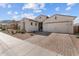 Charming single-Gathering home featuring a brick-paved driveway and a convenient two-car garage at 21132 W Windsor Ave, Buckeye, AZ 85396