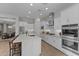 Bright, modern kitchen with stainless steel appliances, large island, and white cabinetry at 21132 W Windsor Ave, Buckeye, AZ 85396