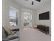 Living room with a view into another room and TV at 21132 W Windsor Ave, Buckeye, AZ 85396