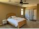 Bedroom with neutral paint, carpet flooring and access to a closet and a window at 21544 W Watkins St, Buckeye, AZ 85326