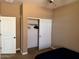 Bedroom showcasing a white closet and light-colored walls and carpet at 21544 W Watkins St, Buckeye, AZ 85326