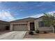 Charming one-story home with a two car garage and low-maintenance landscaping at 21544 W Watkins St, Buckeye, AZ 85326