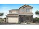 Beautiful two-story home with a modern design, stone accents, and a two-car garage at 2283 E Foremaster Rd, San Tan Valley, AZ 85140