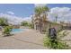 Spacious backyard with a pool, gravel landscaping, and a view of the home's exterior at 2579 E Camellia Dr, Gilbert, AZ 85296