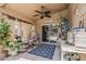 Cozy covered patio with a ceiling fan, comfortable seating, and a view of the pool at 2579 E Camellia Dr, Gilbert, AZ 85296