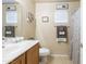 Well-lit bathroom featuring a sink, toilet, and stylish decor at 2725 E Mine Creek Rd # 1208, Phoenix, AZ 85024
