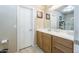 Bright bathroom with vanity, framed mirror and ample lighting at 2725 E Mine Creek Rd # 1208, Phoenix, AZ 85024